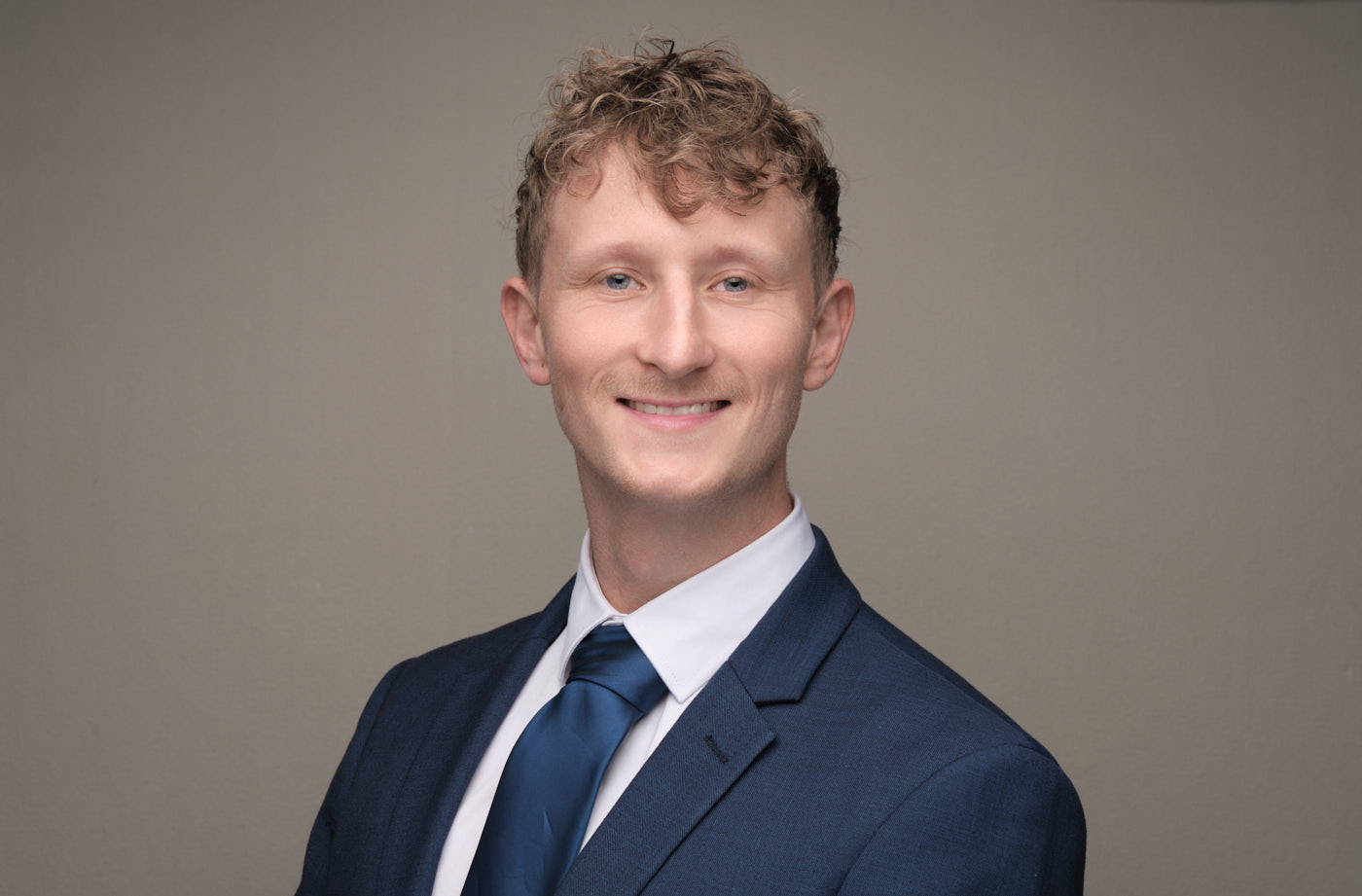 Toby Bell-Ramsay, AI consultant and systems engineer, Christchurch, studio headshot
